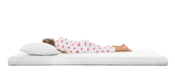 Little girl sleeping on comfortable mattress against white background