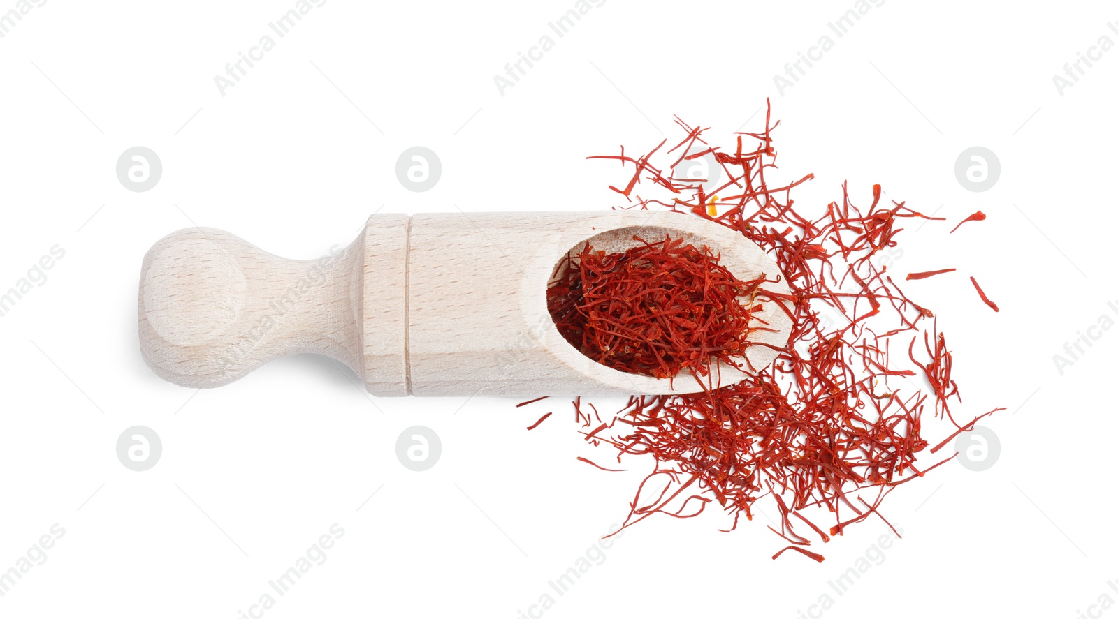 Photo of Aromatic saffron and scoop isolated on white, top view