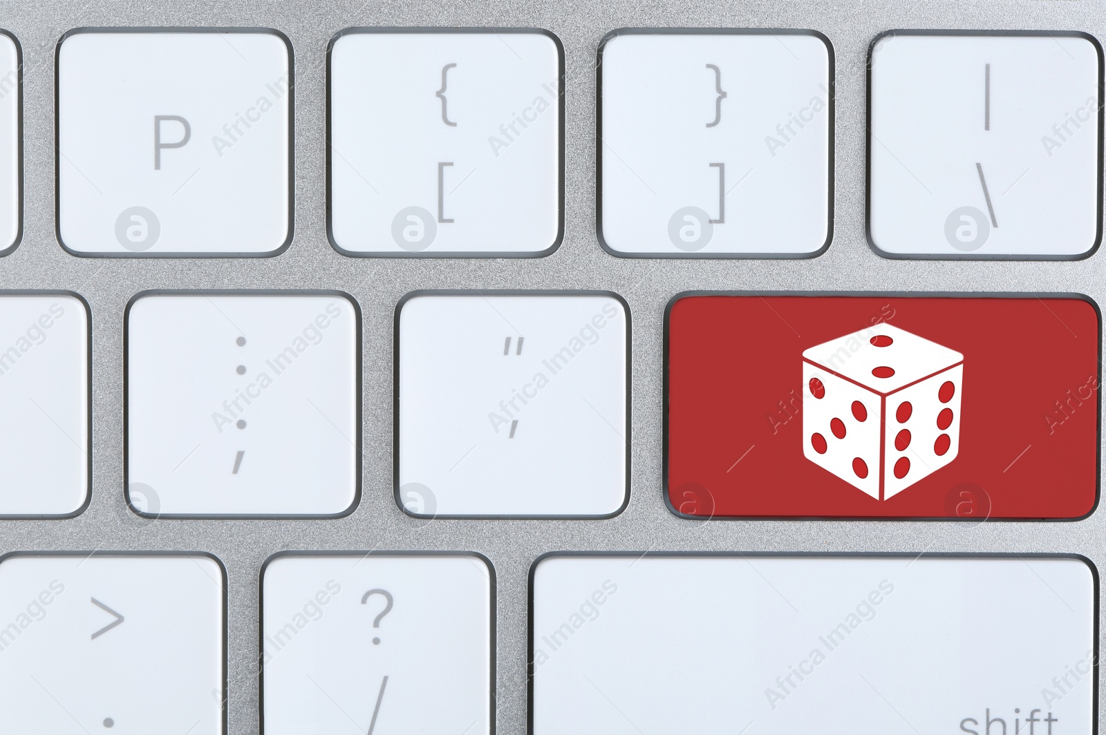 Image of Computer keyboard with dice image, closeup. Online games concept