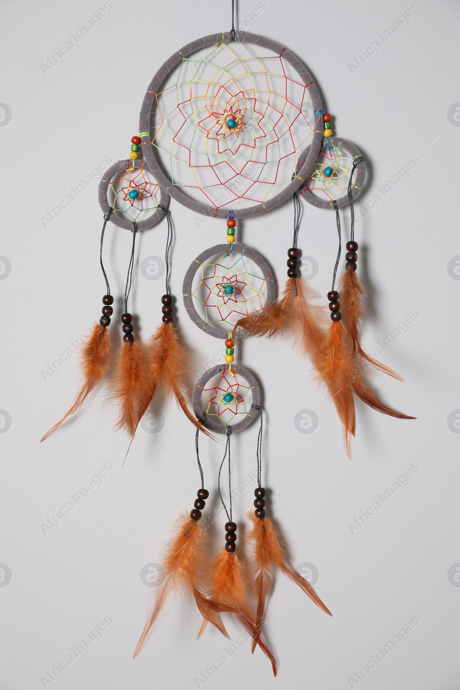 Photo of Beautiful dream catcher hanging on white wall