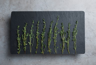 Photo of Fresh thyme on grey table, flat lay