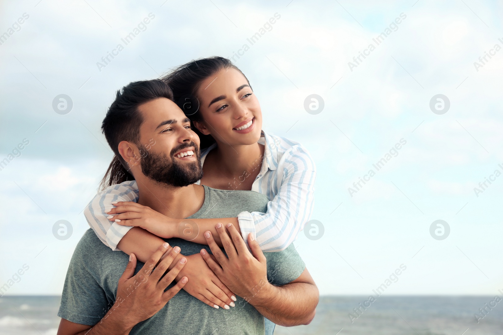 Photo of Lovely couple spending time together near sea