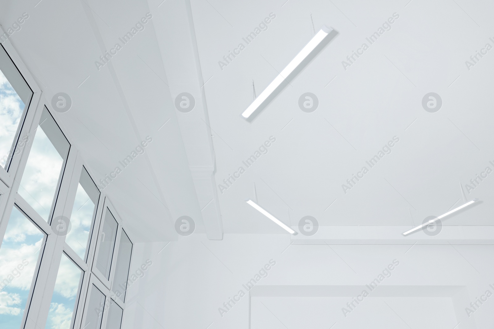 Photo of Ceiling with modern lights in renovated room