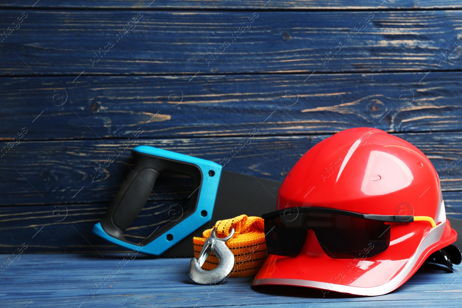 Photo of Composition with construction tools on table against wooden background, space for text