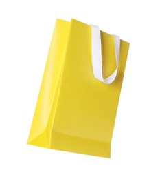 Photo of One yellow shopping bag isolated on white