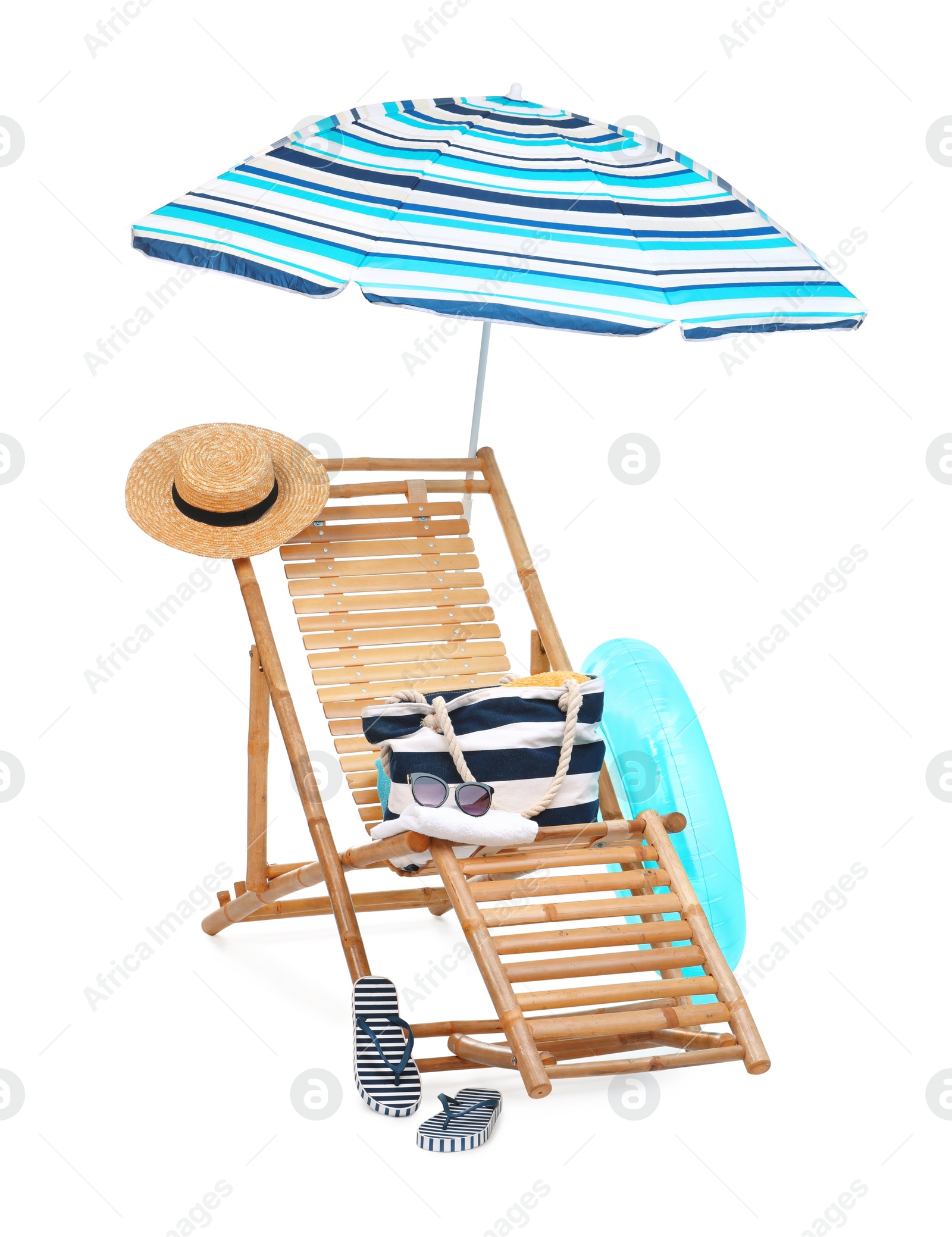 Deck chair, umbrella and other beach accessories isolated on white Photo of Deck chair, umbrella and other beach accessories isolated on white