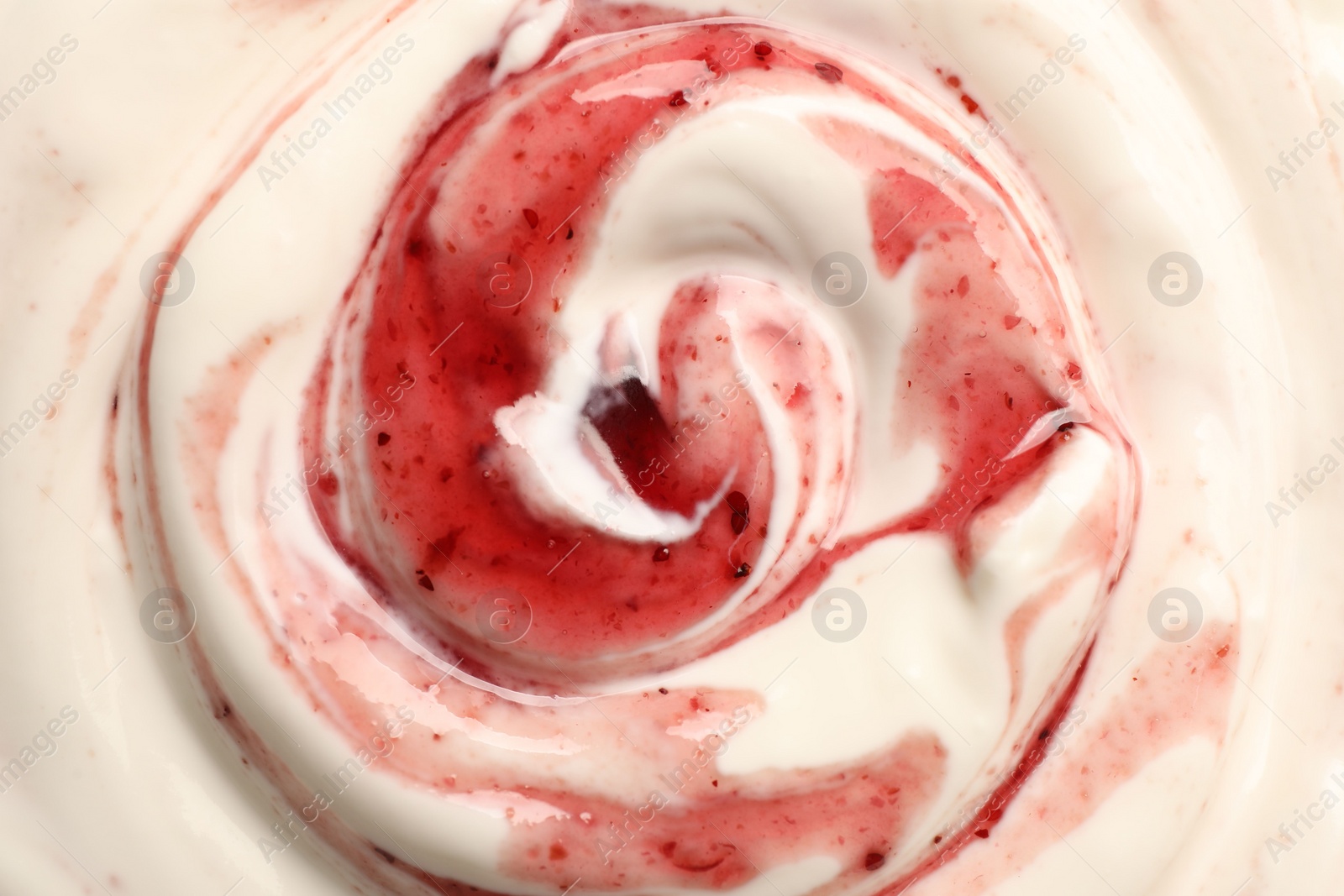 Photo of Tasty yoghurt with jam as background, top view