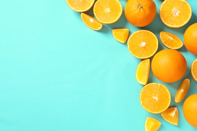 Photo of Flat lay composition with ripe oranges and space for text on color background