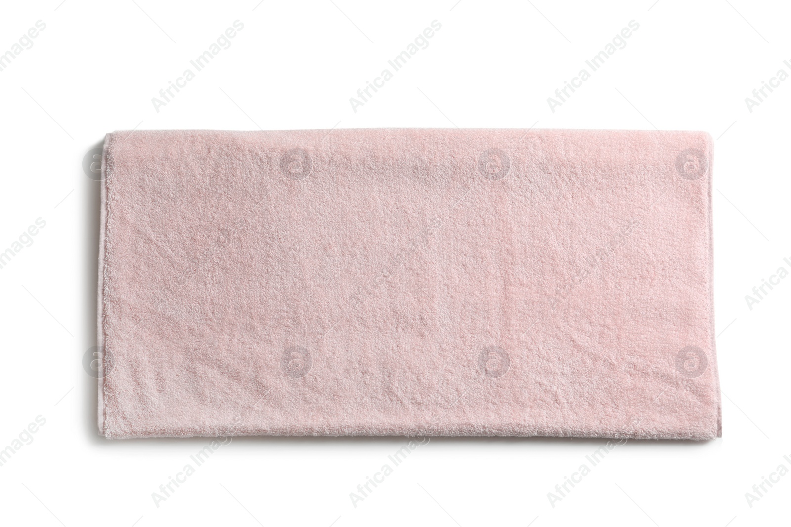 Photo of Folded soft terry towel on white background, top view