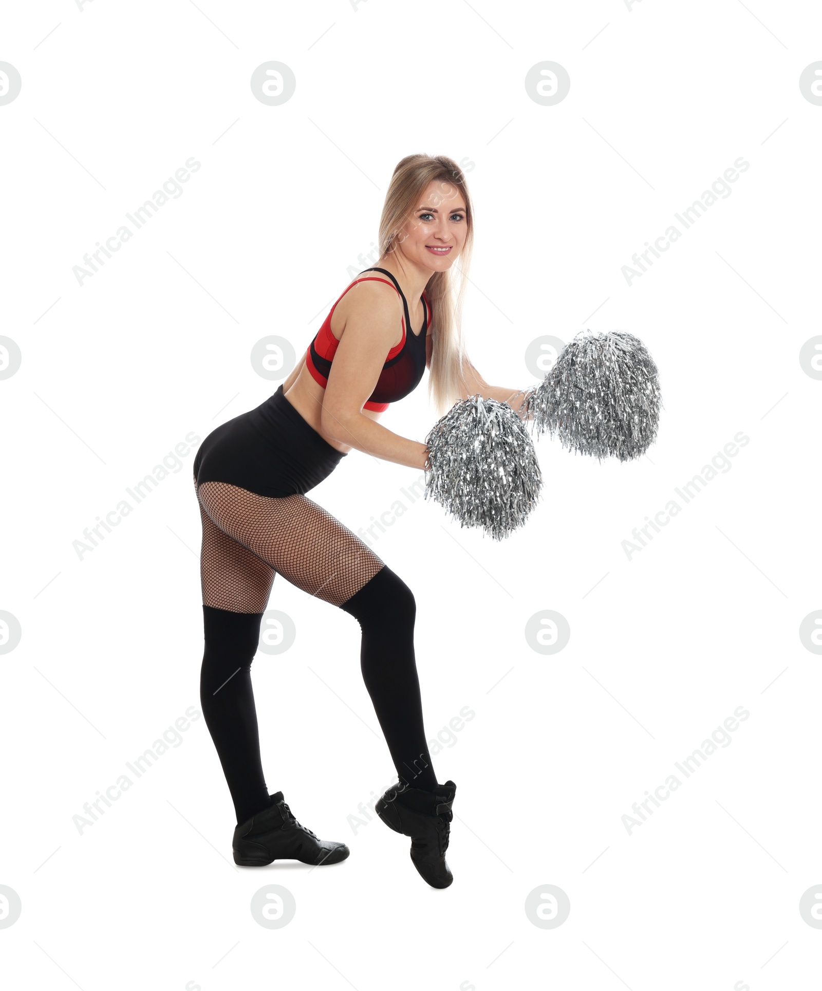 Photo of Beautiful cheerleader in costume holding pom poms on white background