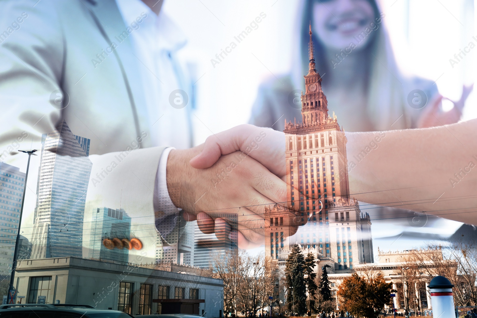 Image of Deal or partnership concept. Double exposure with cityscape and photo of businesspeople shaking hands