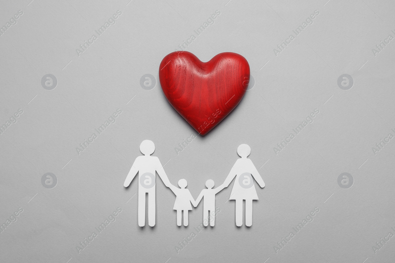 Photo of Paper family cutout and red heart on grey background, flat lay. Insurance concept