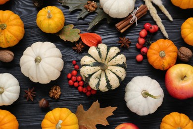 Photo of Thanksgiving day. Flat lay composition with pumpkins on black wooden table