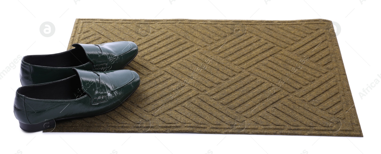Photo of New clean door mat with shoes on white background