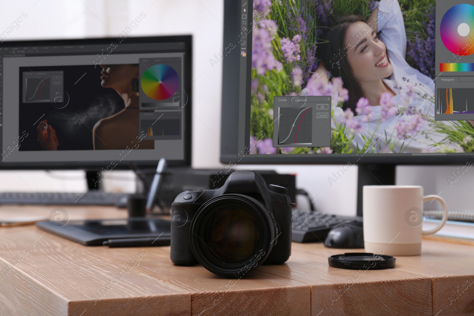 Photo of Retoucher's workplace. Professional camera on wooden table indoors