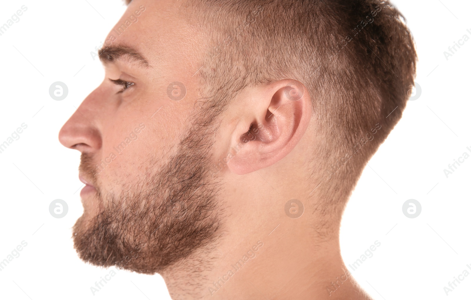 Photo of Young man on white background, closeup. Hearing problem