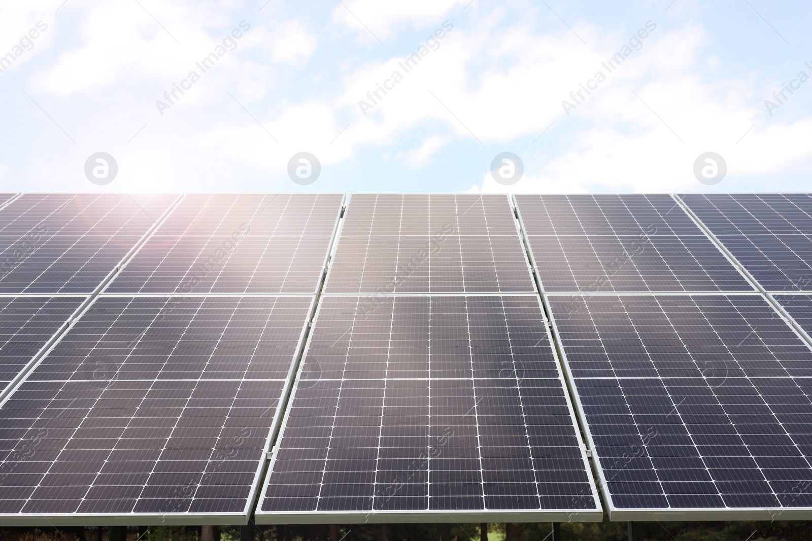 Photo of Solar panels outdoors on sunny day. Alternative energy