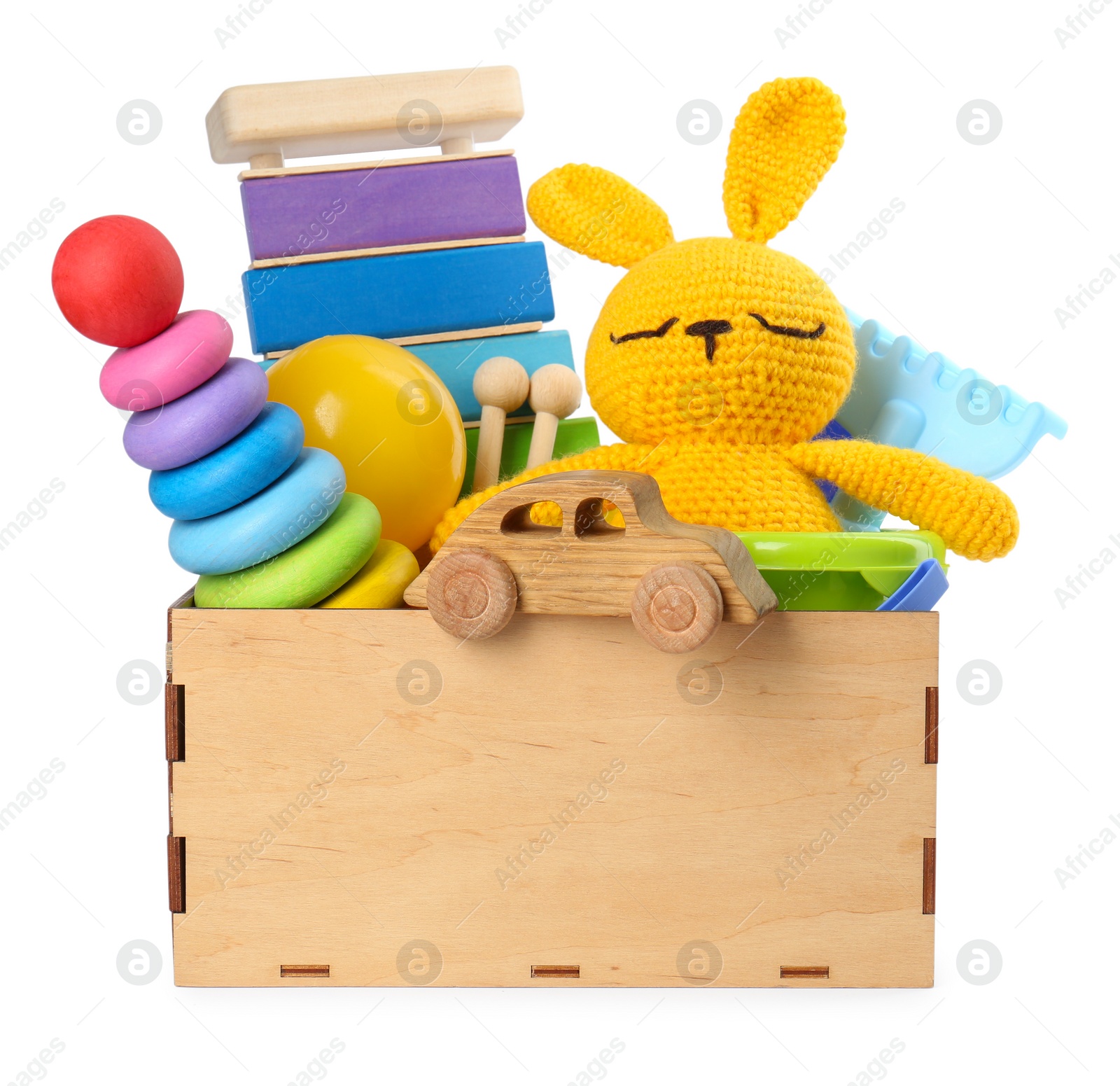 Photo of Many different children's toys in crate isolated on white