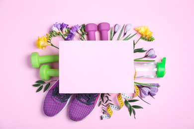 Photo of Spring flowers, sports items and blank card with space for text on pink background, flat lay