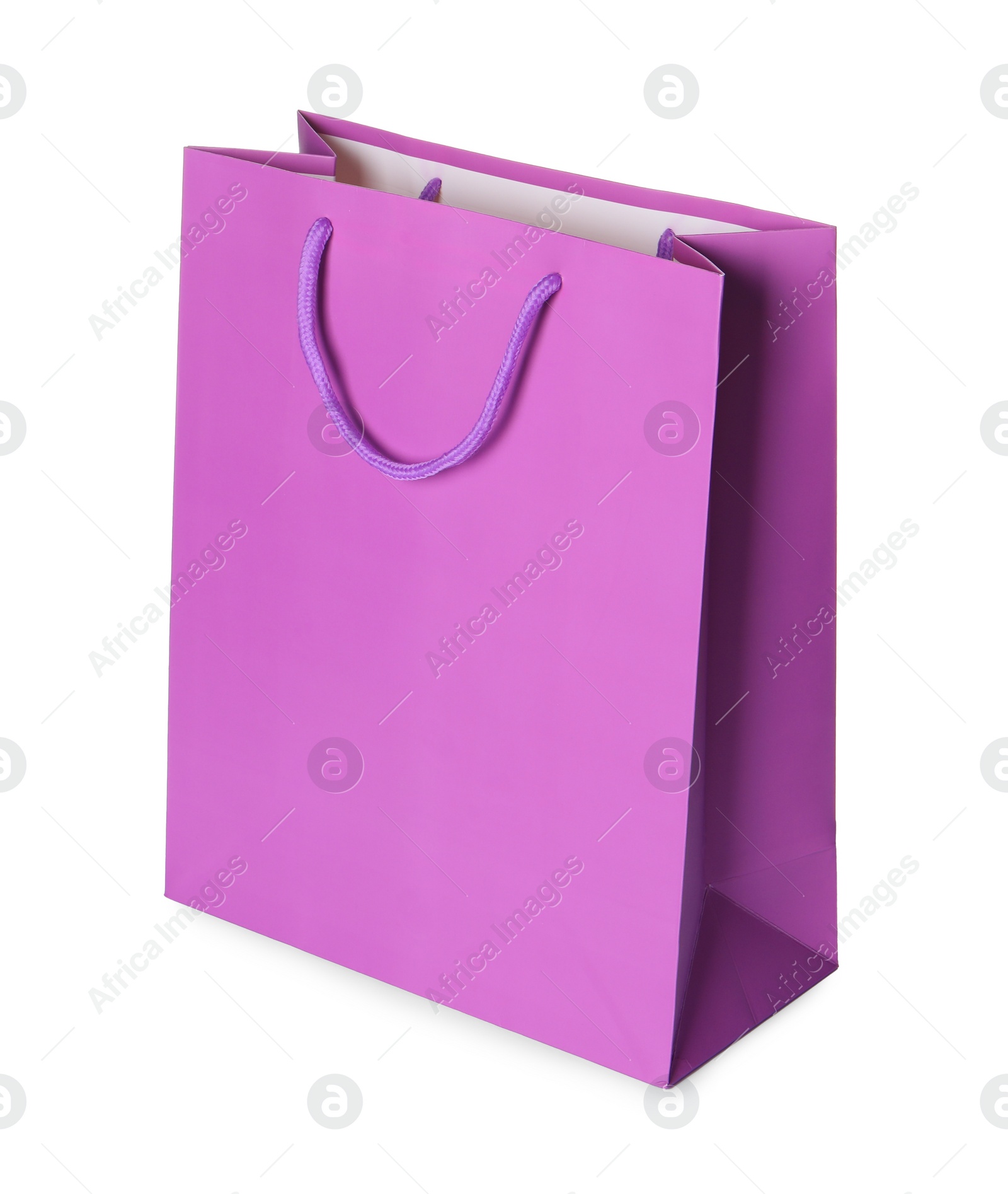 Photo of One violet shopping bag isolated on white