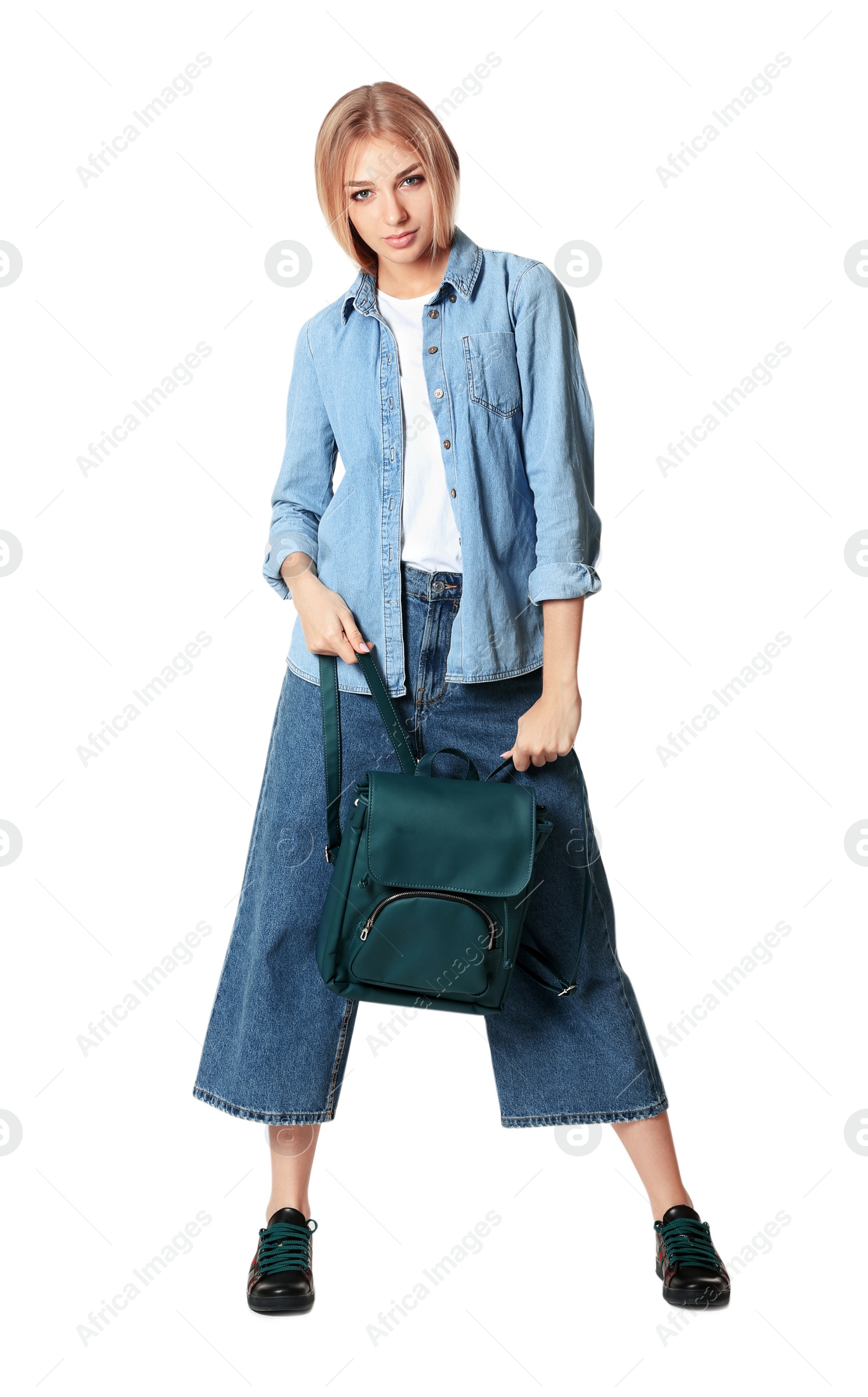 Photo of Full length portrait of woman in stylish shoes holding backpack isolated on white