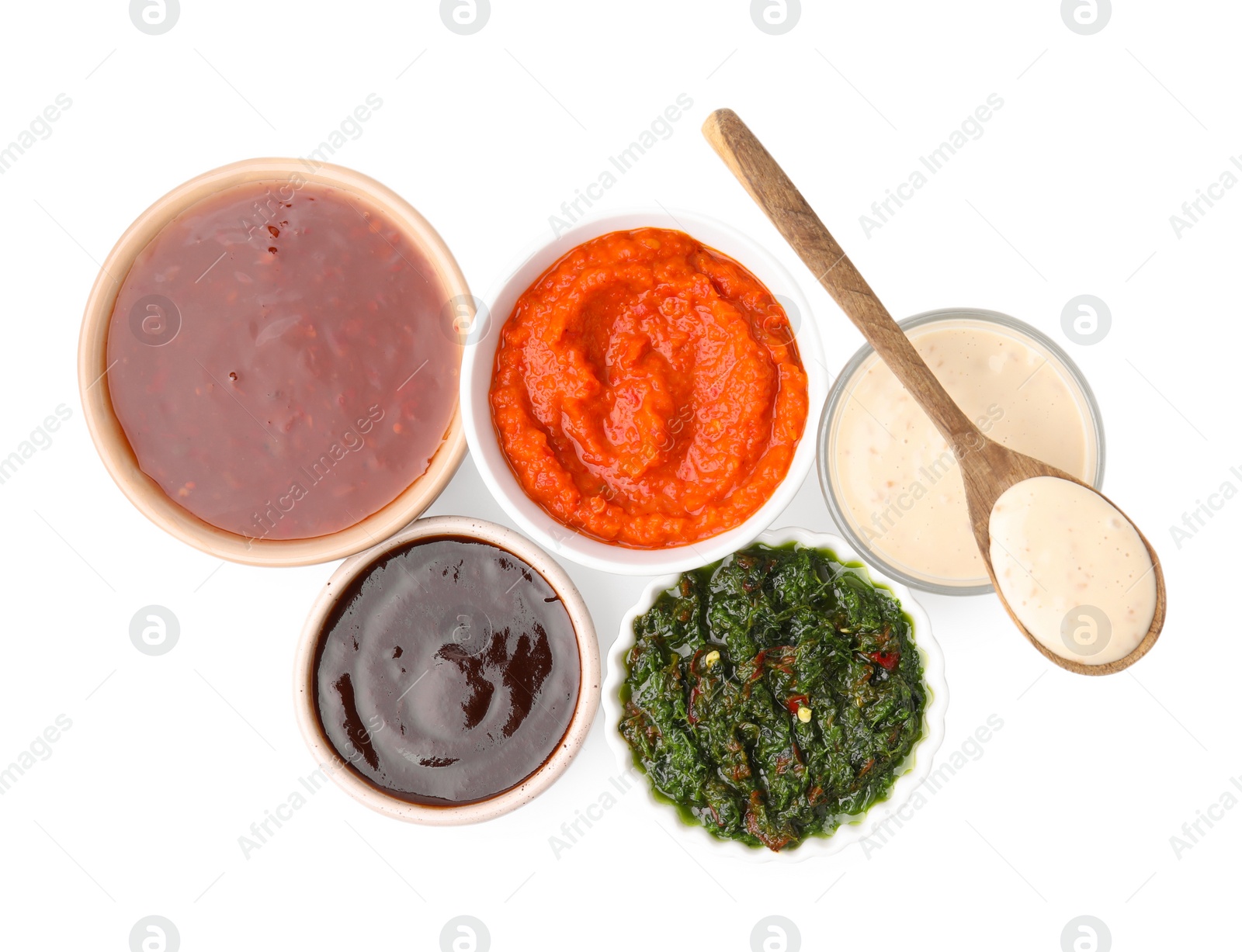 Photo of Different marinades isolated on white, top view