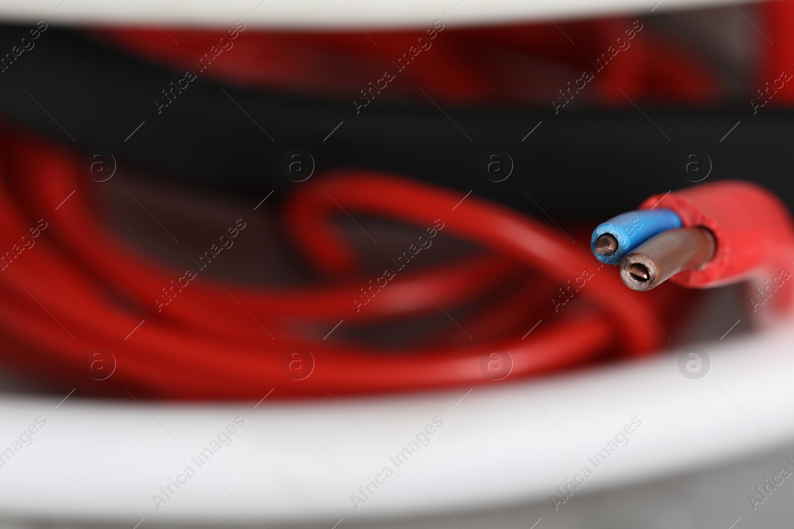 Photo of Colorful electrical wire on blurred background, closeup