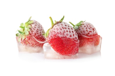 Photo of Fresh strawberries frozen in ice cubes on white background