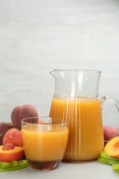 Natural freshly made peach juice on light table