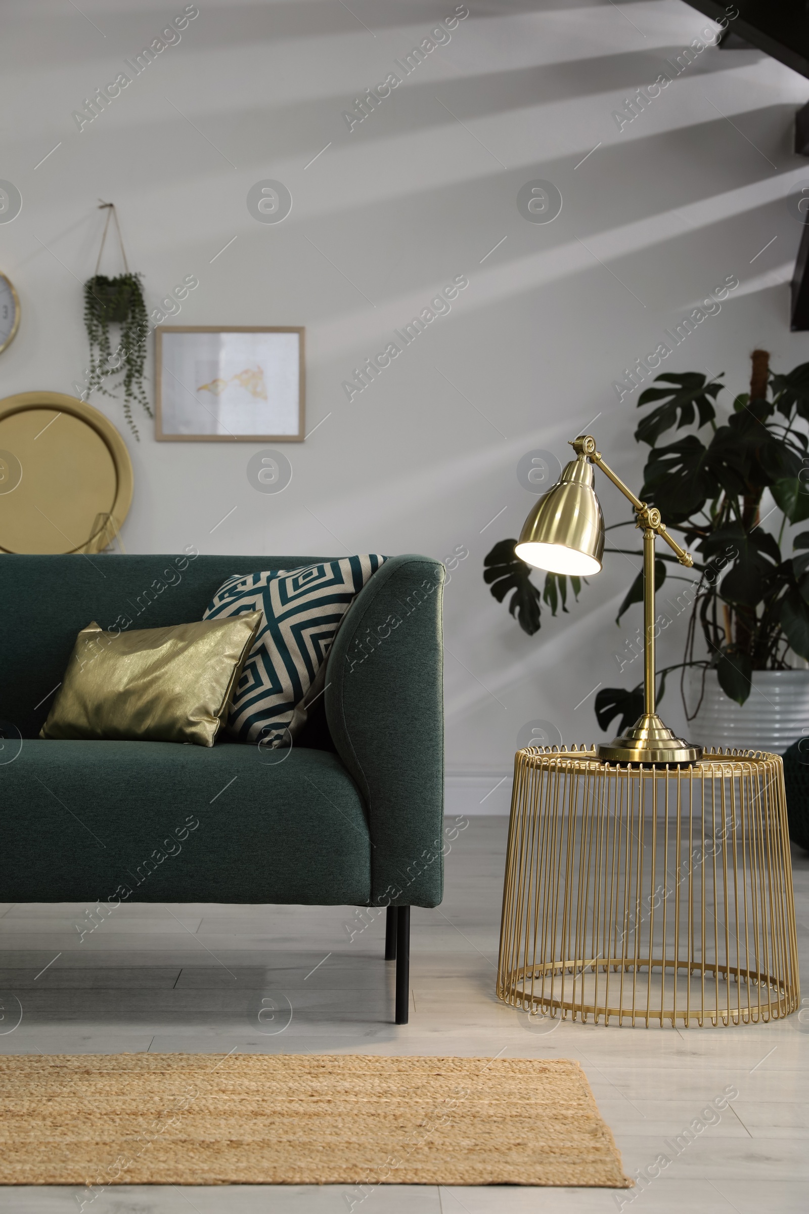 Photo of Living room interior with stylish lamp and comfortable sofa