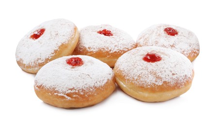 Photo of Delicious donuts with jelly and powdered sugar on white background