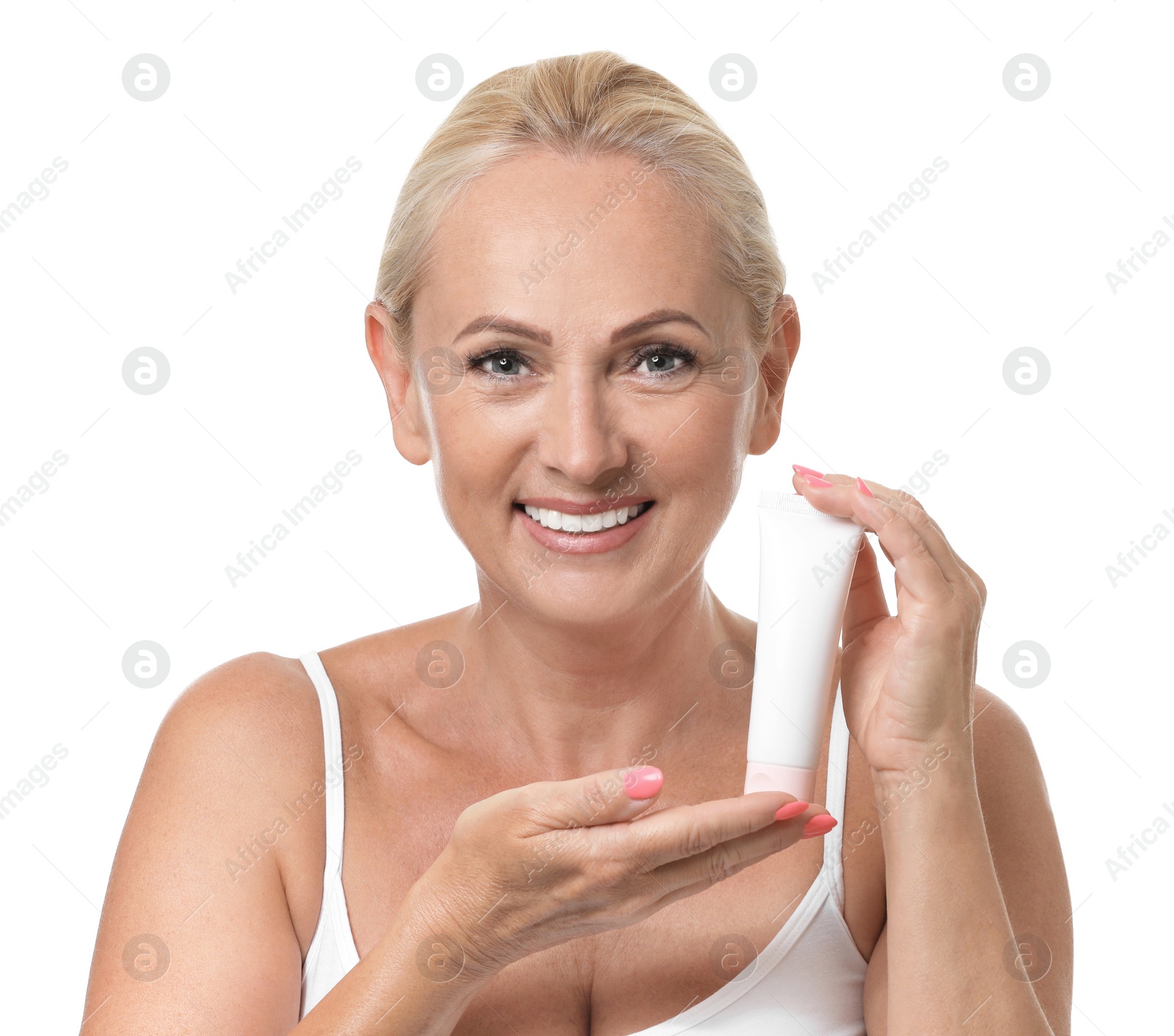 Photo of Portrait of beautiful mature woman with perfect skin holding tube of cream on white background