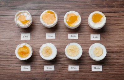 Different cooking time and readiness stages of boiled chicken eggs on wooden table, flat lay