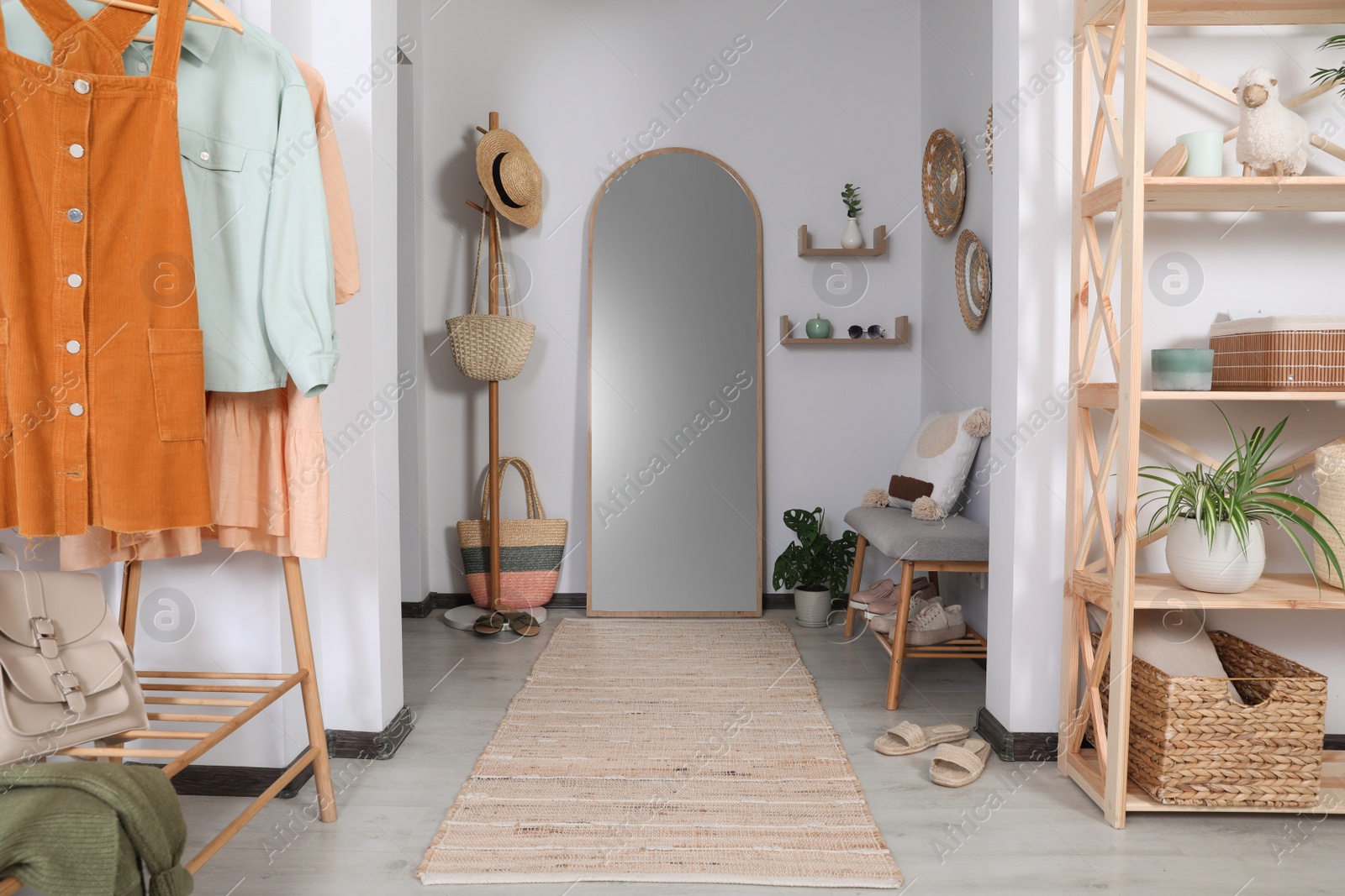 Photo of Hallway interior with stylish furniture and floor mirror