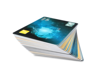 Stack of plastic credit cards on white background