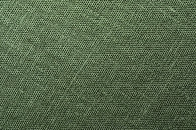 Texture of green fabric as background, top view