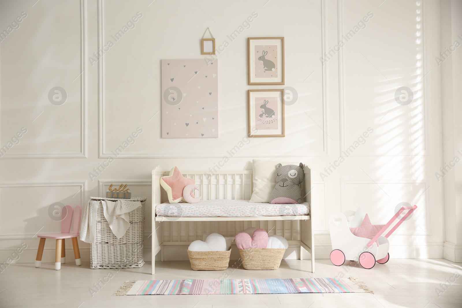 Photo of Baby room interior with stylish furniture and toys