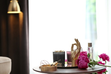 Photo of Composition with stylish accessories and interior elements on table indoors