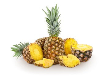 Image of Cut and whole pineapples isolated on white