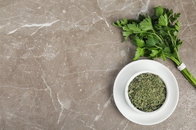 Photo of Flat lay composition with fresh and dried parsley on marble table. Space for text