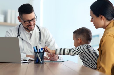 Mother and son visiting pediatrician in hospital