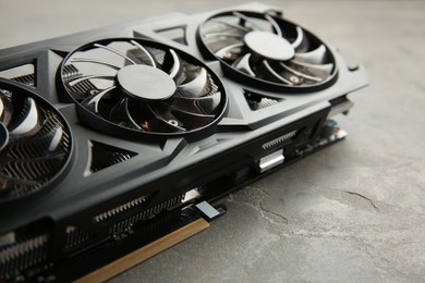 Photo of One graphics card on grey table, closeup