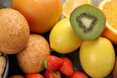 Photo of Allergenic food. Different fresh products on grey table, closeup