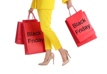 Woman with shopping bags on white background, closeup. Black Friday Sale