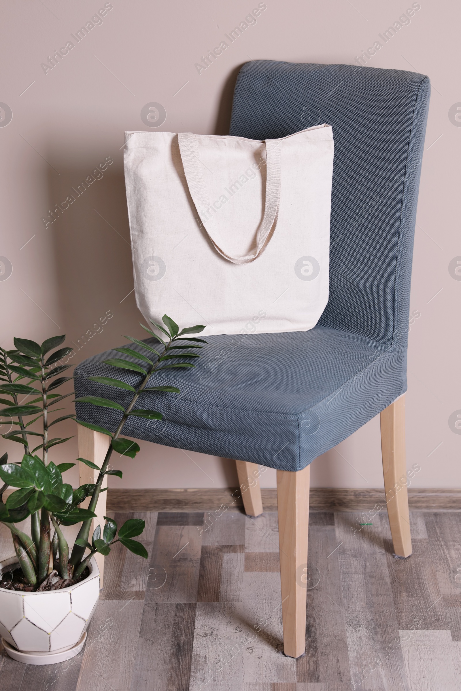 Photo of Eco tote bag in room interior. Space for design