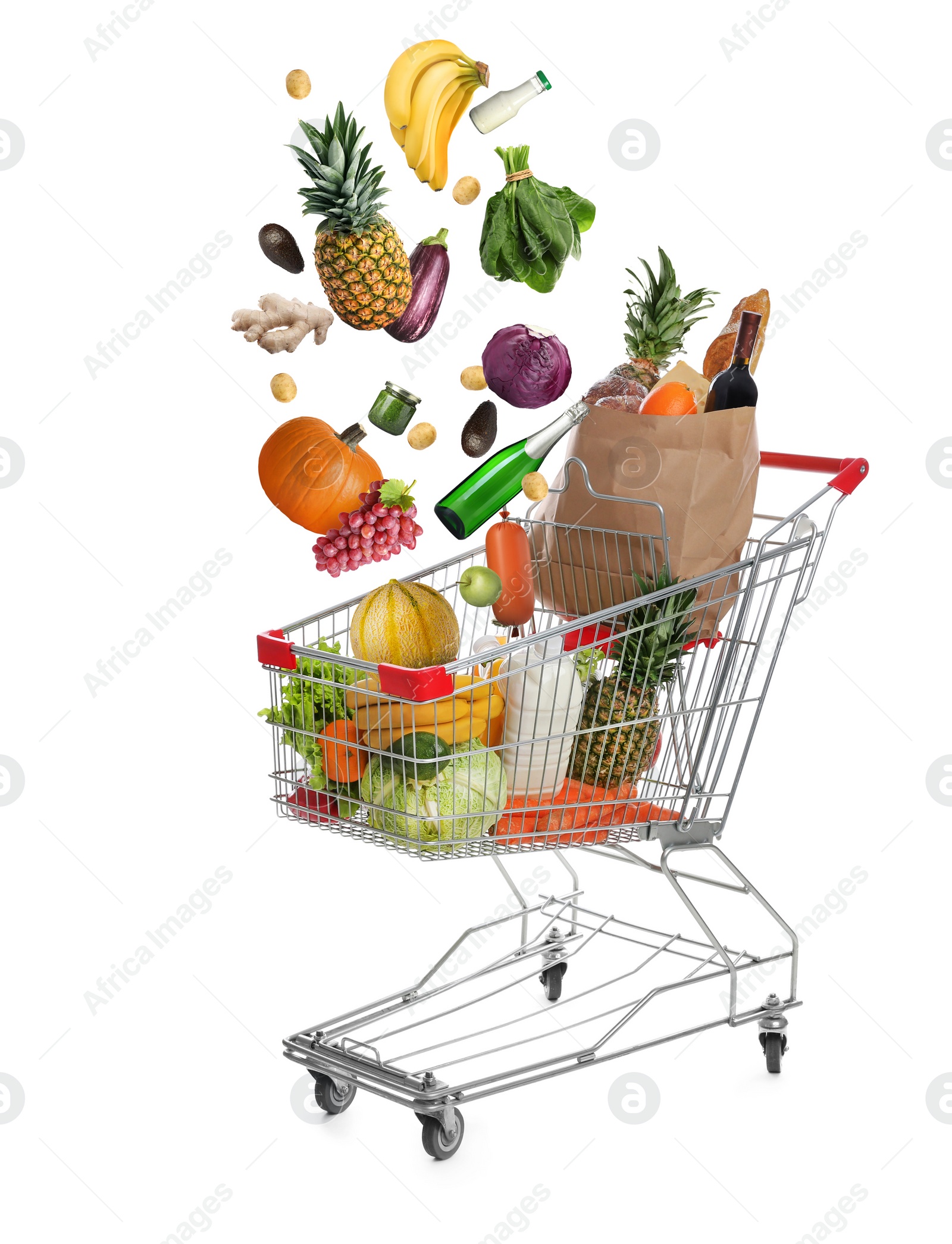 Image of Market assortment. Different products falling into shopping cart on white background