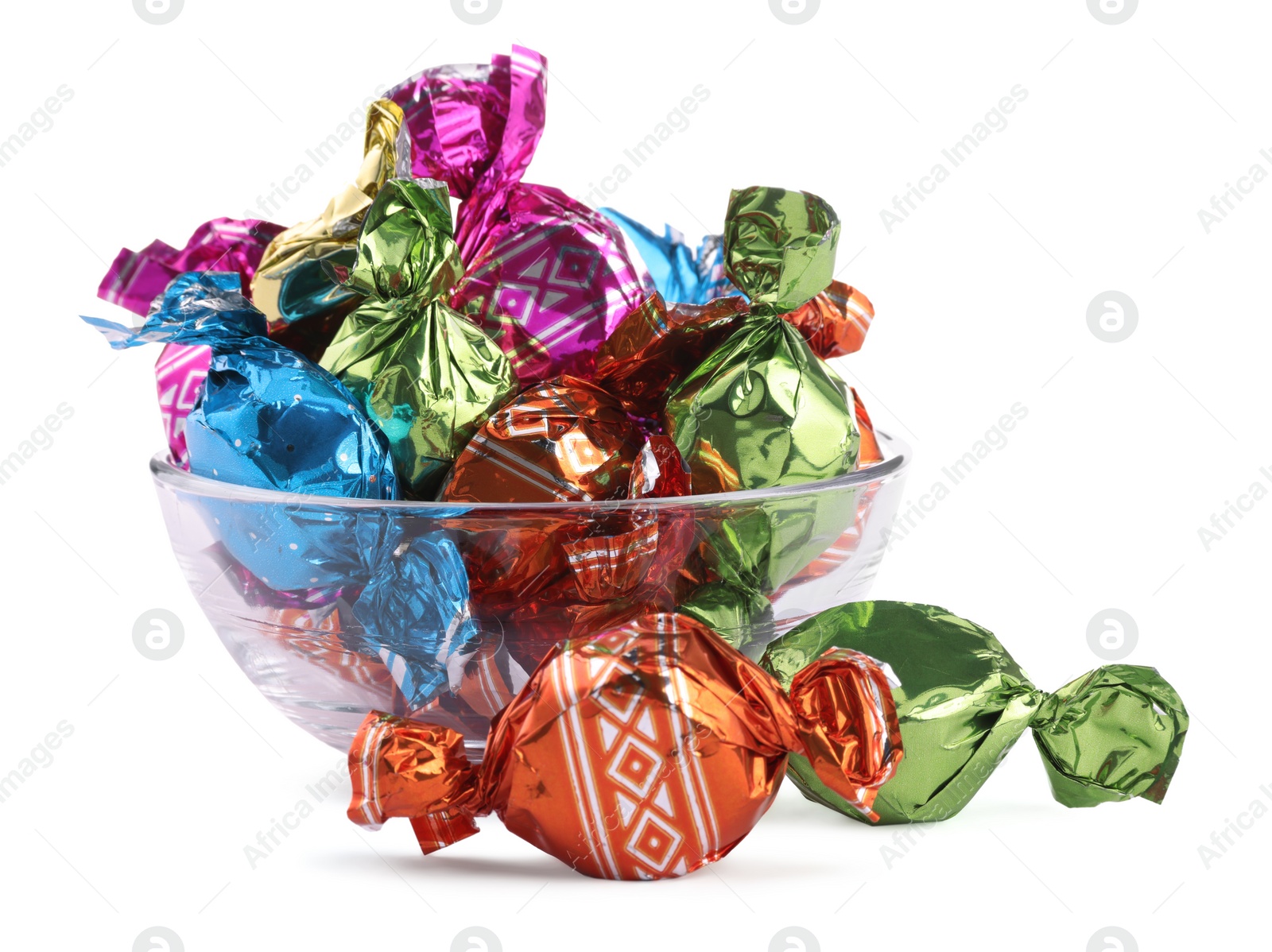 Photo of Bowl with candies in colorful wrappers isolated on white