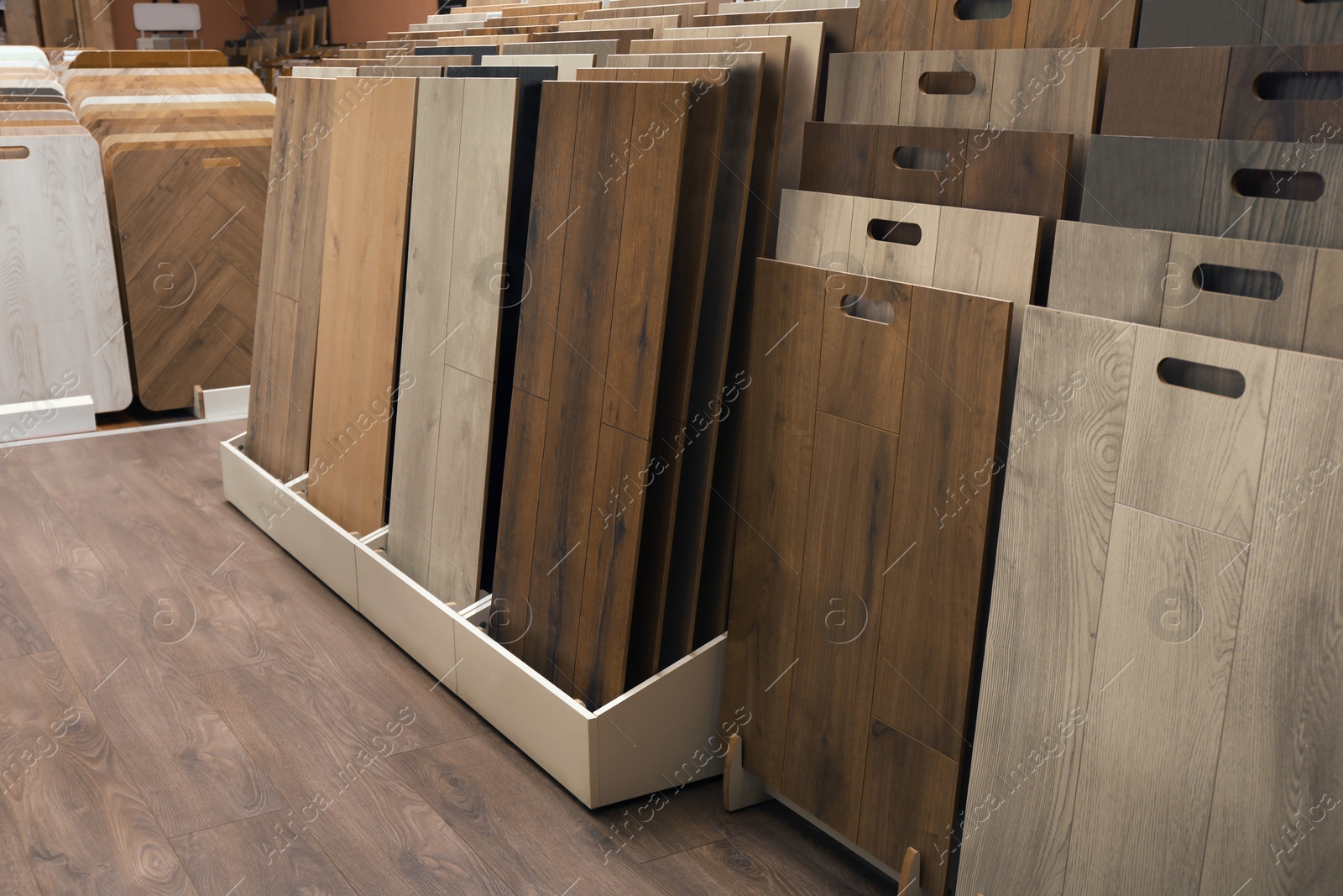 Photo of Many different samples of wooden flooring in store