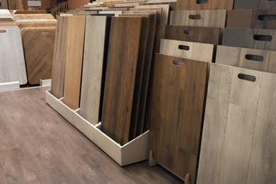 Photo of Many different samples of wooden flooring in store