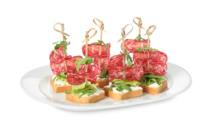 Photo of Tasty canapes with salami, greens and cream cheese isolated on white